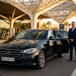 Black Mercedes-Benz E-Class with MoroccoLuxuryTaxi Plate at Marrakech Airport